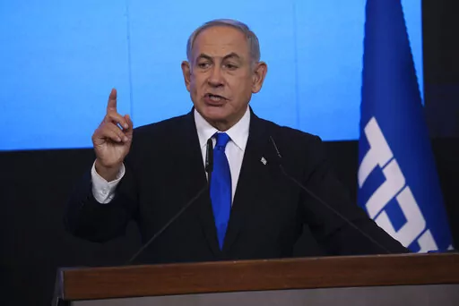 Benjamin Netanyahu, former Israeli Prime Minister and the head of Likud party, speaks to his supporters after first exit poll results for the Israeli Parliamentary election at his party's headquarters in Jerusalem on Nov. 2, 2022. Netanyahu announced late Wednesday, Dec. 21, 2022, that he has successfully formed a new coalition, setting the stage for him to return to power as head of the most right-wing Israeli government ever. (AP Photo/Oren Ziv, File)