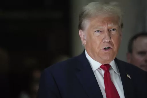 Former President Donald Trump, speaks to reporters as he leaves the courtroom during a lunch break in his civil business fraud trial, Oct. 4, 2023, in New York. Trump's lawyers have asked a judge to postpone his Florida classified documents trial until after next year’s presidential election. The lawyers say they have not received all the records they need to prepare Trump's defense. (AP Photo/Mary Altaffer, File)