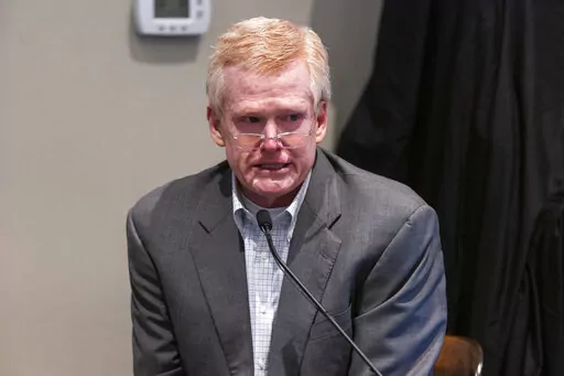 Defendant Alex Murdaugh is cross examined by prosecutor Creighton Waters while testifying during his murder trial at the Colleton County Courthouse in Walterboro, S.C., Friday, Feb. 24, 2023. The 54-year-old attorney is standing trial on two counts of murder in the shootings of his wife and son at their Colleton County, S.C., home and hunting lodge on June 7, 2021. (Joshua Boucher/The State via AP, Pool)