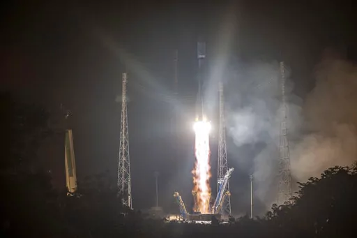 This photo provided by the CNES shows a Russian Soyuz rocket lifting off from the Kourou space base, French Guiana, early Wednesday Dec.18, 2019. The war in Ukraine is causing a swift and broad decaying of scientific ties between Russia and the West. (JM Guillon/ESA-CNES-Arianespace via AP, File)