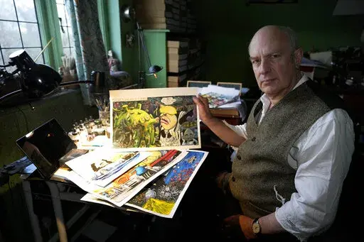 Martin Rowson shows Britain's Prime Minister Boris Johnson cartoons as he poses for a photographer in his studio in London, Monday, Jan. 24, 2022. So the bad news besetting British Prime Minister Boris Johnson over allegations of lockdown-breaching government parties has been good news for Britain's humorists, producing an outpouring of satirical responses. Political cartoonist Martin Rowson says mockery is one of the trade-offs in democratic societies between government and governed: “They ha