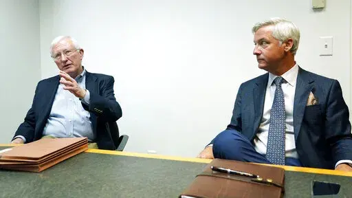 Former Mississippi Gov. Ronnie Musgrove speaks left,, Tuesday, May 31, 2022, in Jackson, Miss., about teaming up with Quentin Whitwell, right, a healthcare executive, to apply for a state license to open a medical marijuana testing facility, Magnolia Tech Labs, in Marshall County. (AP Photo/Rogelio V. Solis)