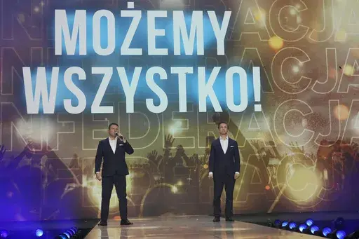 Slawomir Mentzen, left, and Krzysztof Bosak, right, the co-leaders of the hard right Confederation party, present their party slogan "Mozemy Wszystko!" (We Can Do Anything) at a convention in Katowice, Poland, on Saturday, Sept. 23, 2023. Confederation has been growing in popularity, especially among young men. The party has been riding a wave of growing support for far-right parties across Europe, and polls show it could increase its presence in parliament in a national election Oct. 15. No mat