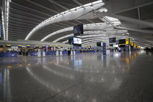Terminal 5 at Heathrow Airport in London, which handles British Airways flights, stands virtually empty of passengers as staff standby to help during a British Airways pilots' strike, Monday, Sept. 9, 2019. British Airways cancelled dozens of flights on Friday, May 26, 2023, due to computer problems, disrupting the plans of thousands of travelers at the start of a busy holiday weekend. (AP Photo/Matt Dunham, File)