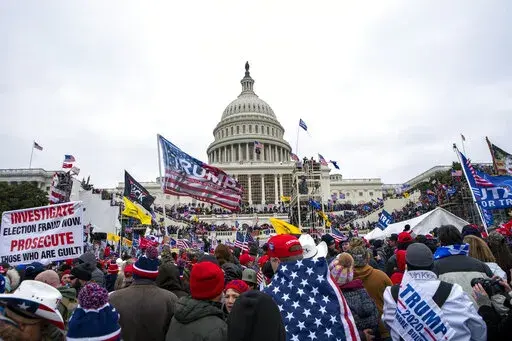 Rioters loyal to President Donald Trump rally at the U.S. Capitol in Washington on Jan. 6, 2021. A new poll shows that a year after the deadly Jan. 6 insurrection at the U.S. Capitol, only about 4 in 10 Republicans recall the attack by supporters of former President Donald Trump as very violent or extremely violent. A new poll shows that a year after the deadly Jan. 6 insurrection at the U.S. Capitol, only about 4 in 10 Republicans recall the attack by supporters of former President Donald Trump