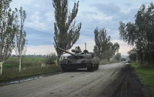 Ukrainian servicemen drive a tank on the way to Siversk, Donetsk region, Ukraine, Saturday, Oct. 1, 2022. (AP Photo/Inna Varenytsia)