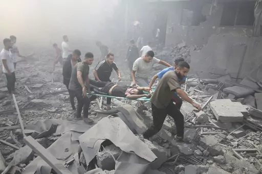 Palestinians evacuate wounded people after an Israeli airstrike in Rafah refugee camp, southern Gaza Strip, Thursday, Oct. 12, 2023. As Israel escalates its war on Hamas, it will confront many of the same dilemmas it has grappled with over decades of conflict with the Palestinians. It will want to punish Hamas like never before, but without killing so many Palestinian civilians that it loses international support. (AP Photo/Hatem Ali)