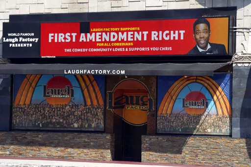 A message expressing support for comedian Chris Rock is displayed on the digital marquee of the Laugh Factory comedy club, Wednesday, March 30, 2022, in Los Angeles. Rock was slapped onstage by best actor winner Will Smith after making a joke about Smith's wife Jada Pinkett Smith during Sunday night's Academy Awards telecast. (AP Photo/Chris Pizzello)