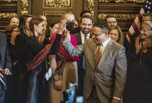 Attorney General Keith Ellison gives a high five to Katy Johnson, who was once addicted to vaping in St. Paul, Minn., on Wednesday, May 17, 2023. innesota says it settled its lawsuit against e-cigarette maker Juul Labs and tobacco giant Altria for $60.5 million. The state’s lawsuit was the first and still the only one of thousands of cases nationwide against the e-cigarette maker to reach trial. (Richard Tsong-Taatarii/Star Tribune via AP)