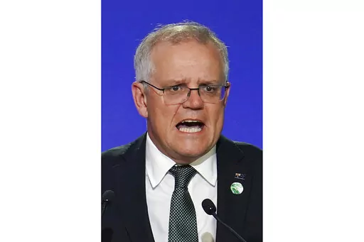 Australia's Prime Minister Scott Morrison delivers an address, during the COP26 Summit, at the SECC in Glasgow, Scotland, Monday, Nov. 1, 2021. In at least one sense, Morrison is the most successful Australian prime minister in years. He is the first to survive in office from one election to the next since 2007. That year, the government of Australia's second-longest-serving Prime Minister John Howard was voted out after a reign of almost 12 years. (Ian Forsyth/Pool Photo via AP, File)