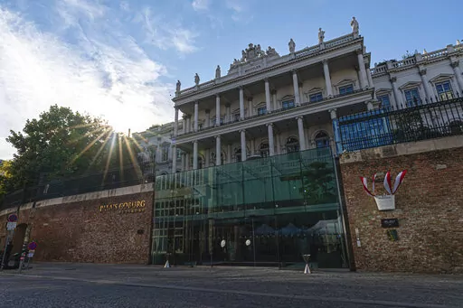 The sun sets behind the Palais Coburg where closed-door nuclear talks take place in Vienna, Austria, Aug. 5, 2022. Talks to revive Tehran's tattered nuclear accord with world powers in Vienna ended Monday, Aug. 8, 2022, as the parties closed a final text and the Iranian negotiator prepared to return to his capital, diplomats said. (AP Photo/Florian Schroetter, File)