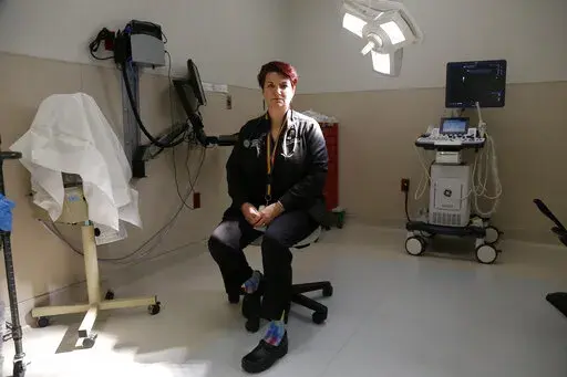 Dr. Colleen McNicholas, chief medical officer at Planned Parenthood of the St. Louis Region and Southwest Missouri, sits in a surgical room on April 11, 2022, at the Planned Parenthood clinic in Fairview Heights, Ill. Midwestern Planned Parenthood officials on Monday, Oct. 3, 2022, announced plans for a mobile abortion clinic — a 37-foot RV that will stay in Illinois but travel to near the border of adjoining states that have banned the procedure since the Supreme Court overturned Roe v. Wade 