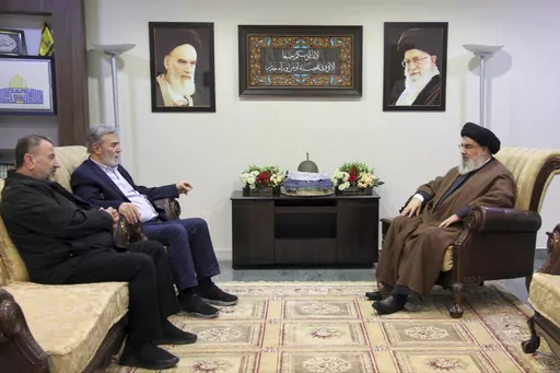 In this photo released on Oct. 25, 2023, by the Hezbollah Media Relations Office, Hezbollah leader Sayyed Hassan Nasrallah, right, meets with Ziad al-Nakhleh, the head of Palestinian Islamic Jihad, center, and Hamas deputy chief, Saleh al-Arouri, in Beirut. When the Lebanese militia Hezbollah announced last week that its leader Hassan Nasrallah would deliver his first public speech since the outbreak of the Israel-Hamas war, much of the region held its breath. (Hezbollah Media Relations Office, 