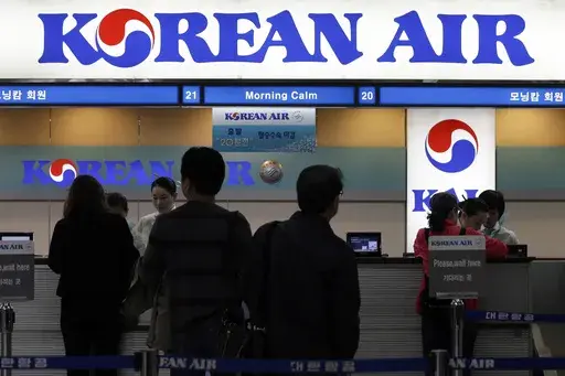 Passengers approach a Korean Air counter at Gimpo airport in Seoul, South Korea, Oct. 25, 2012. Cups of Shin Ramyun instant noodles, which have become a fan favorite among Korean Air travelers over the years, will no longer be available for Economy class passengers starting August 15, 2024, a spokesperson for the Seoul-based airline confirmed. (AP Photo/Lee Jin-man, File)