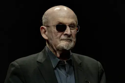 Salman Rushdie poses for a portrait to promote his book "Knife: Meditations After an Attempted Murder", at the Deutsches Theater in Berlin, Germany, Thursday, May 16, 2024. (AP Photo/Ebrahim Noroozi, File)