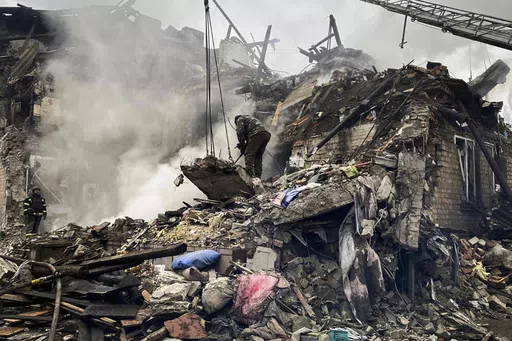 In this photo provided by the Ihor Moroz, Head of the Donetsk Regional Military Administration, rescuers work at the scene of a building damaged by shelling, in Novogrodivka, Ukraine, Thursday, Nov. 30, 2023. (Ihor Moroz, Head of the Donetsk Regional Military Administration via AP)