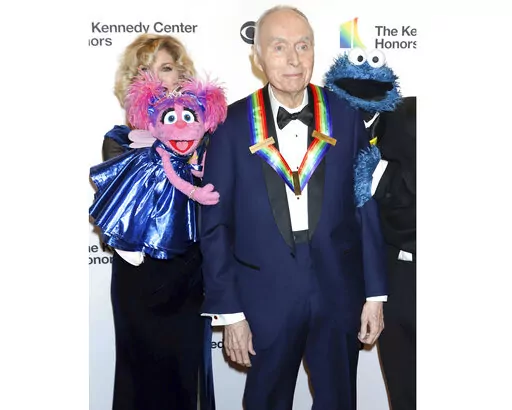 Honoree Lloyd Morrisett appears with muppet characters at the 42nd Annual Kennedy Center Honors at The Kennedy Center, Sunday, Dec. 8, 2019, in Washington. Morrisett, the co-creator of the beloved children's education TV series “Sesame Street,” which uses empathy and fuzzy monsters like Abby Cadabby, Elmo and Cookie Monster to charm and teach generations around the world, has died. He was 93. Morrisett’s death was announced Tuesday by Sesame Workshop, the nonprofit he helped establish unde