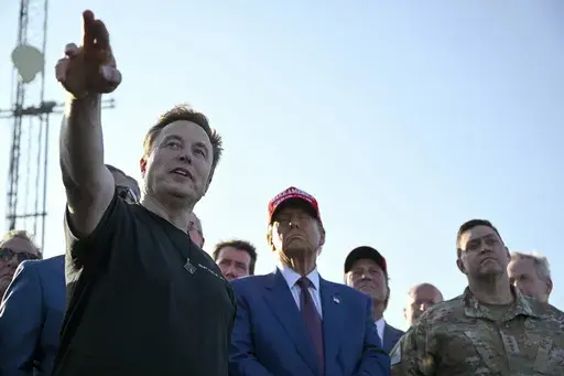 Elon Musk talks with President-elect Donald Trump before the launch of the sixth test flight of the SpaceX Starship rocket Tuesday, Nov. 19, 2024 in Boca Chica, Texas. (Brandon Bell/Pool via AP, File)
