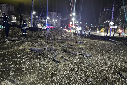 This handout photo released by Telegram Channel of Belgorod Region Governor Vyacheslav Gladkov shows the site of the crater after an explosion in Belgorod, Russia, Friday, April 21, 2023. A large explosion hit Belgorod late Thursday, and the Defense Ministry said one of its Su-34 warplanes accidentally discharged ammunition over the city about 25 kms. (15 miles) from the Ukrainian border. Belgorod Regional Gov. Vyacheslav Gladkov said the blast injured at least two people, damaged homes and left
