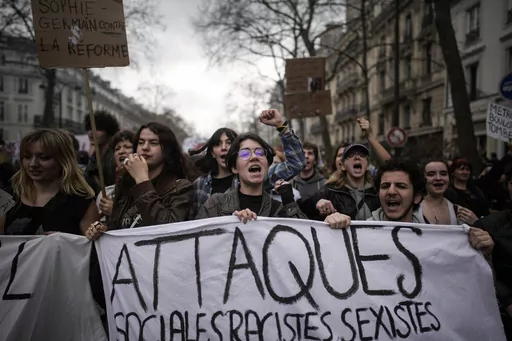 Protesters march during a rally in Paris, on March 23, 2023. French President Emmanuel Macron has ignited a firestorm of anger with unpopular pension reforms that he rammed through parliament. Young people, some of them first-time demonstrators, are joining protests against him. Violence is also picking up. (AP Photo/Christophe Ena, File)