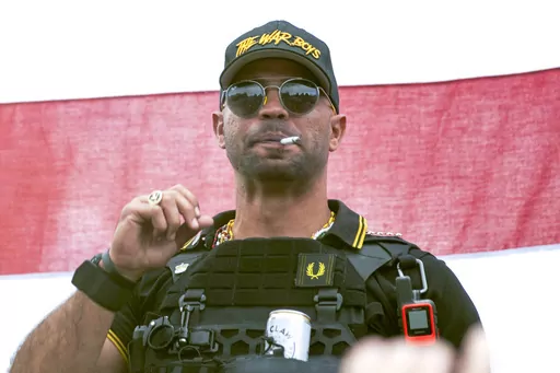 Proud Boys leader Henry "Enrique" Tarrio wears a hat that says The War Boys during a rally in Portland, Ore., Sept. 26, 2020. A federal jury is set to hear closing arguments in the historic trial of Proud Boys extremist group leaders charged with plotting to use force to keep former President Donald Trump in power. Starting Monday, April 24, 2023, prosecutors and defense lawyers will make their final appeals to jurors who will decide the fate of former Proud Boys national chairman Enrique Tarrio