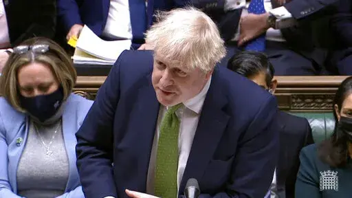 In this screen shot taken from video, Britain's Prime Minister Boris Johnson speaks during Prime Minister's Questions in the House of Commons, London, Wednesday, Jan. 19, 2022.  Johnson faced a grilling from opponents in Parliament as well as a threat from his own party's lawmakers over a string of lockdown-flouting government parties. Conservative legislators are judging whether to trigger a no-confidence vote in Johnson over the “partygate” scandal. Johnson and loyal ministers are trying t
