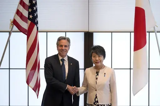 U.S. Secretary of State Antony Blinken, left, and Japanese Foreign Minister Yoko Kamikawa shake hands before their bilateral meeting at the Foreign Ministry's Iikura guesthouse in Tokyo, Sunday, July 28, 2024. (AP Photo/Hiro Komae)