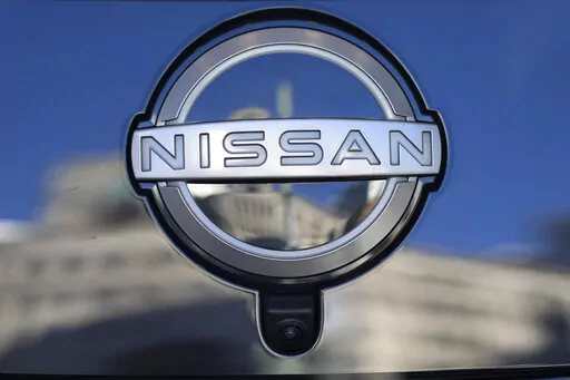 A Nissan logo is seen on a car at its showroom in Tokyo, Feb. 21, 2023. Nissan is recalling more than 809,000 small SUVs in the U.S. and Canada, Tuesday, Feb. 28, because a key problem can cause the ignition to shut off while they’re being driven. The recall covers Rogues from the 2014 through 2020 model years, as well as Rogue Sports from 2017 through 2022. (AP Photo/Shuji Kajiyama, File)
