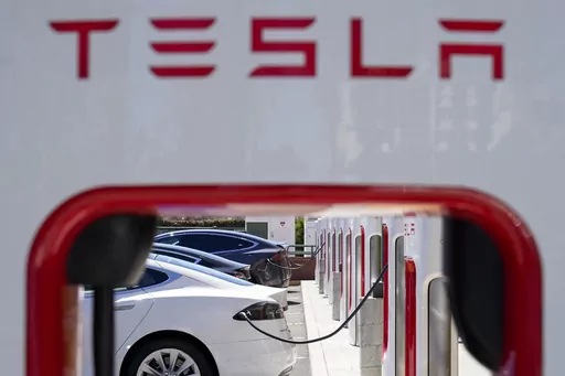 Tesla vehicles charge at a station in Emeryville, Calif., Aug. 10, 2022. Tesla has found itself locked in an increasingly bitter dispute with union workers in Sweden and neighboring countries. The showdown pits the electric car maker's CEO Elon Musk, who's staunchly anti-union, against the strongly held labor ideals of the Nordic countries. (AP Photo/Godofredo A. Vásquez, File)