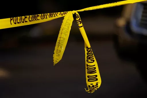 Tape cordons off the scene where multiple people were shot including police officers in Philadelphia, Wednesday, Oct. 12, 2022. In a report issued this week, homicides in 2023 are declining in a cross-section of American cities, though their numbers remain higher than before the coronavirus pandemic took hold, according to a new report analyzing data from 30 U.S. cities. (AP Photo/Matt Rourke, File)