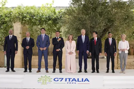 From left, European Council President Charles Michel, German Chancellor Olaf Scholz, Canada's Prime Minister Justin Trudeau, French President Emmanuel Macron, Italian Prime Minister Giorgia Meloni, U.S. President Joe Biden, Japan's Prime Minister Fumio Kishida, Britain's Prime Minister Rishi Sunak and European Commission President Ursula von der Leyen stand for a group photo at the G7, Thursday, June 13, 2024, in Borgo Egnazia, Italy. (AP Photo/Alex Brandon)