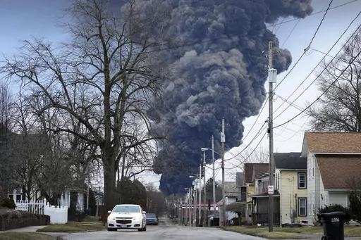 A black plume rises over East Palestine, Ohio, as a result of a controlled detonation of a portion of the derailed Norfolk Southern trains, Feb. 6, 2023. (AP Photo/Gene J. Puskar, File)