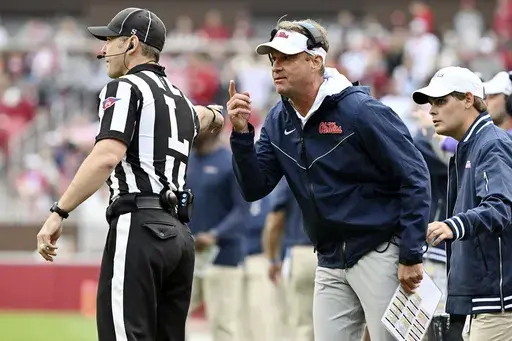 Mississippi coach Lane Kiffin reacts after an offensive pass interference call in the end zone against them during the first half of an NCAA college football game against Arkansas, Saturday, Nov. 2, 2024, in Fayetteville, Ark. (AP Photo/Michael Woods)
