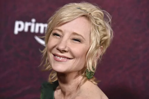 Anne Heche arrives at the premiere of "The Tender Bar" on Dec. 12, 2021, at the TCL Chinese Theatre in Los Angeles. Heche was in the hospital Saturday, Aug. 6, 2022, following an accident in which her car smashed into a house and flames erupted, a representative for the actor told People magazine. The representative, who was not identified, told the magazine that Heche was in stable condition a day after Friday's accident. (Photo by Jordan Strauss/Invision/AP, File)