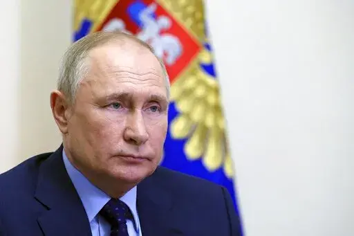 Russian President Vladimir Putin chairs a Security Council meeting via videoconference at the Novo-Ogaryovo residence outside Moscow, Russia, Thursday, April 7, 2022.  The credit ratings agency Standard & Poor's has downgraded its assessment of Russia’s ability to repay foreign debt, Friday, April 8. That indicates Moscow could soon default on external loans for the first time in more than a century.   (Mikhail Klimentyev, Sputnik, Kremlin Pool Photo via AP, File)