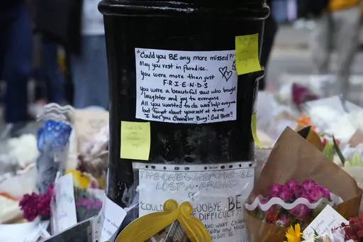 A makeshift memorial for Matthew Perry is seen outside the building shown in exterior shots of the television show "Friends" on Monday, Oct. 30, 2023, in New York. Perry, who played Chandler Bing on NBC's "Friends" for 10 seasons, was found dead at his Los Angeles home on Saturday. He was 54. (Photo by Charles Sykes/Invision/AP)