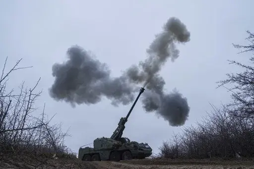 A Ukrainian brigade fires a self-propelled howitzer toward Russian front-line positions in the Donetsk region of eastern Ukraine on Thursday, Jan. 23, 2025. (AP Photo/Evgeniy Maloletka)