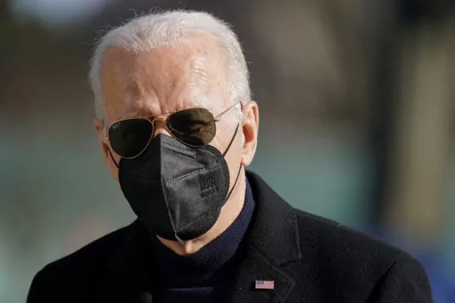 President Joe Biden walks on the South Lawn of the White House after stepping off Marine One, Sunday, Feb. 6, 2022, in Washington. Biden returned to Washington after spending the weekend at his home in Delaware. (AP Photo/Patrick Semansky)