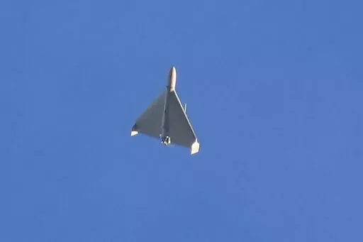 A drone is seen in the sky seconds before it fired on buildings in Kyiv, Ukraine, Monday, Oct. 17, 2022. (AP Photo/Efrem Lukatsky)