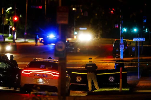 Memphis Police officers work an active shooter scene on Poplar Avenue in Memphis, Tenn. Wednesday, Sept. 7, 2022. Police in Memphis, Tennessee, said a man who drove around the city shooting at people during an hours-long rampage that forced frightened people to shelter in place Wednesday has been arrested. (Mark Weber/Daily Memphian via AP)