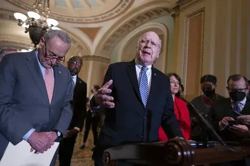 From left, Senate Majority Leader Chuck Schumer, D-N.Y., Sen. Raphael Warnock, D-Ga., Sen. Patrick Leahy, D-Vt., chair of the Senate Appropriations Committee, and Sen. Amy Klobuchar, D-Minn., chair of the Senate Rules Committee, talk about the need for the John Lewis Voting Rights Advancement Act, as they speak to reporters following a Democratic policy meeting at the Capitol in Washington, Nov. 2, 2021. Democrats are mounting an impassioned push to overhaul Senate rules that stand in the way of