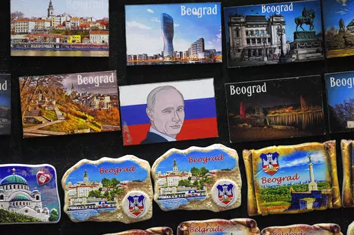 A vendor sells refrigerator magnets showing a picture of Russian President Vladimir Putin, on main pedestrian street in downtown Belgrade, Serbia, Monday, Jan. 16, 2023. Since the start of the war in Ukraine, about 200,000 Russians have left their homeland for Serbia, with many seeking a new life in a fraternal Slavic country free from Kremlin oppression. The Balkan country is a close ally of Moscow, with historic, religious and cultural ties, and Russia backs Serbia’s claim over its former pr