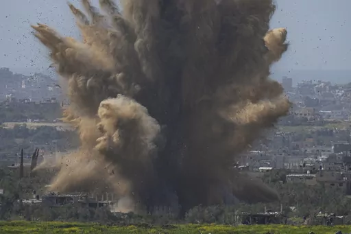 Smoke and debris rise following an explosion in the Gaza Strip as seen from southern Israel, Wednesday, March 6, 2024. (AP Photo/Ohad Zwigenberg)
