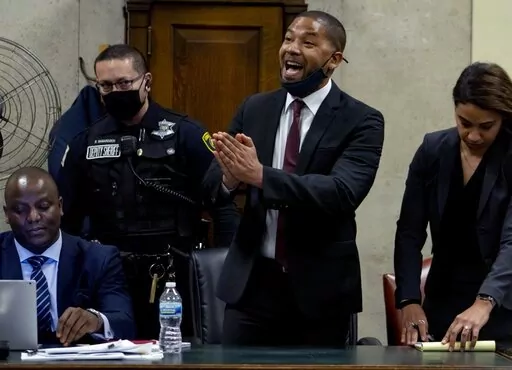 Actor Jussie Smollett speaks to Judge James Linn after his sentence is read at the Leighton Criminal Court Building, Thursday, March 10, 2022, in Chicago. Smollett maintained his innocence during his sentencing hearing Thursday after a judge sentenced the former “Empire” actor to 150 days in jail for lying to police about a racist and homophobic attack that he orchestrated himself. (Brian Cassella/Chicago Tribune via AP, Pool)