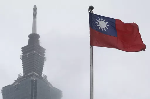 A Taiwan national flag flutters near the Taipei 101 building at the National Dr. Sun Yat-Sen Memorial Hall in Taipei, Taiwan, on May 7, 2023. Taiwan said Wednesday, Nov. 1, 2023 that China sent 43 military aircraft and seven ships near the self-ruled island, the latest sign that Beijing plans no let-up in its campaign of harassment, threats and intimidation. (AP Photo/Chiang Ying-ying, File)