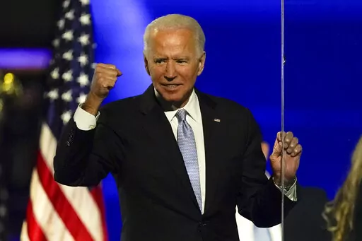 Then-President-elect Joe Biden gestures to supporters Nov. 7, 2020, in Wilmington, Del. Some voters in last year's midterm elections were open to supporting Democrats even if they weren't fond of President Joe Biden. Roughly 1 in 6 voters for Democratic House candidates said they disapproved of Biden's job performance, but most said Biden wasn't a factor in their midterm decision. (AP Photo/Andrew Harnik, File)