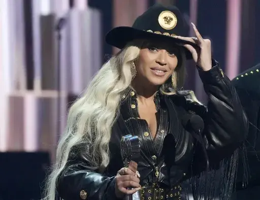 Beyonce, left, accepts the Innovator Award during the iHeartRadio Music Awards, April 1, 2024, at the Dolby Theatre in Los Angeles. (AP Photo/Chris Pizzello, File)