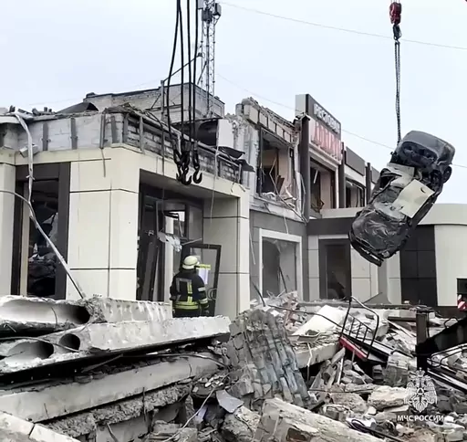 In this photo taken from video released by Russian Emergency Ministry Press Service on Saturday, Feb. 3, 2024, Russian Emergency Ministry employees work at the side of a collapsed bakery after an attack of Ukrainian troops, that Russian officials in Luhansk said was conducted by Ukrainian forces, in Lysychansk, Russian-controlled Luhansk region, eastern Ukraine. According to the Russian Emergency Ministry, five people were found dead under the rubble. Eight people were injured and there might be