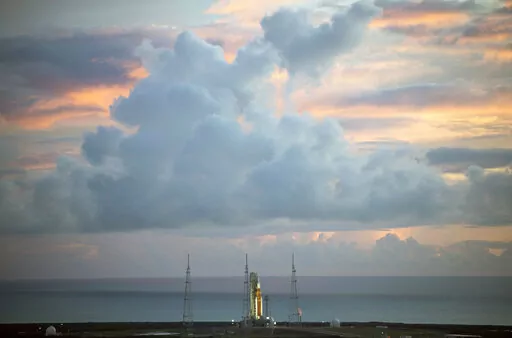 The NASA moon rocket stands ready at sunrise on Pad 39B before the Artemis 1 mission to orbit the moon at the Kennedy Space Center, Monday, Aug. 29, 2022, in Cape Canaveral, Fla. (Joel Kowsky/NASA via AP)