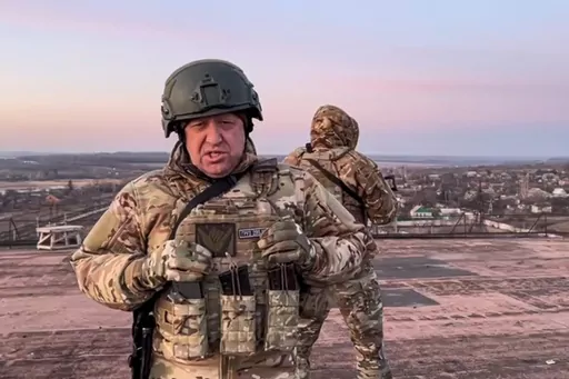In this handout photo taken from video released by Prigozhin Press Service on Friday, March 3, 2023, Yevgeny Prigozhin, the owner of the Wagner Group military company, addresses Ukrainian President Volodymyr Zelenskyy asking him to withdraw the remaining Ukrainian forces from Bakhmut to save their lives, at an unspecified location in Ukraine. Prigozhin's criticism of the top military brass is in stark contrast with more than two decades of rigidly controlled rule by President Vladimir Putin with